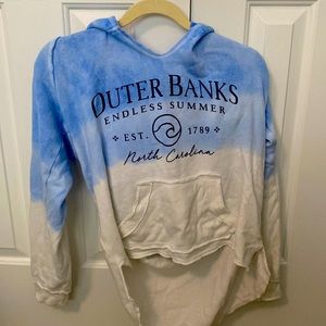 front of sweatshirt is short back is long